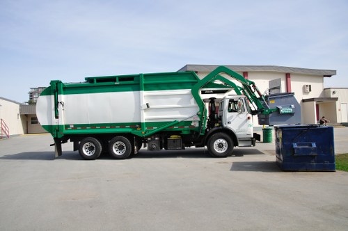 Waste collection vehicle and bins at commercial premises
